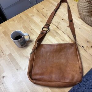 Vintage honey brown boho leather crossbody with western-inspired cabochon strap